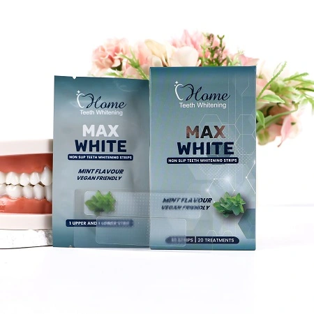 Home Teeth Whitening Max White Strips box, a pouch with strips visible, and individual whitening strips laid out on a clean surface.